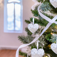 Load image into Gallery viewer, Sand Heart Ornaments are showcased by being placed on a Christmas tree.