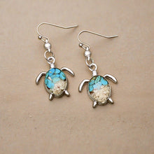 Load image into Gallery viewer, Sand Sea Turtle Earrings displayed on a wooden surface.