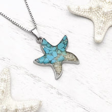 Load image into Gallery viewer, Sand Starfish Necklace in Teal Turquoise displayed on a white wooden surface.