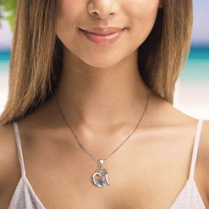 Starfish Love Necklace displayed by being worn around a woman's neck.