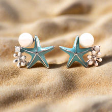 Load image into Gallery viewer, Starfish Pearl Studs shot closely in a bright environment.