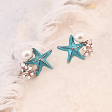 Load image into Gallery viewer, Starfish Pearl Studs displayed on a white furry surface.