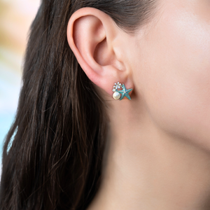  Starfish Pearl Stud displayed by being worn on a woman's ear.
