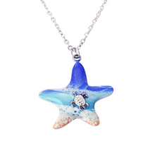 Load image into Gallery viewer, Starfish Sea Turtle Beach Resin Necklace displayed on a white surface.
