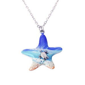 Starfish Sea Turtle Beach Resin Necklace displayed on a white surface.
