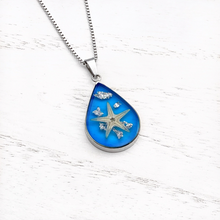 Load image into Gallery viewer, Under the Sea Necklace displayed on a white wooden surface.