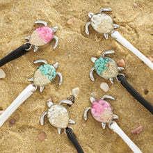 Load image into Gallery viewer, Black and White Rope Sand Sea Turtle Bracelets are all placed on a sandy surface.