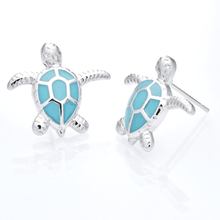 Load image into Gallery viewer, Enamel Sea Turtle Studs displayed on a white smooth surface against a white background.