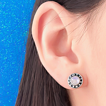 Load image into Gallery viewer, Moonstone Moon Phase Stud displayed closely by being worn on a woman&#39;s ear.