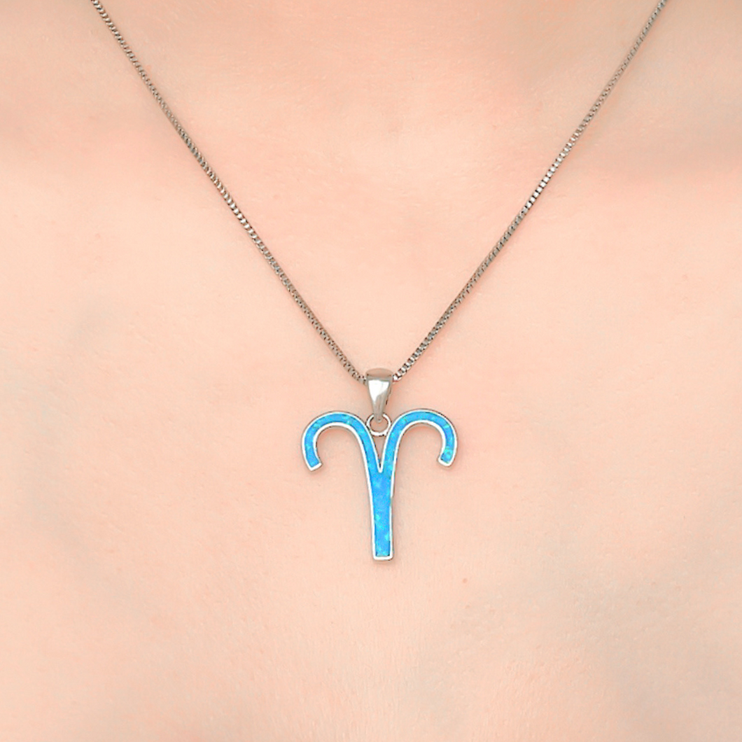 Opal Aries Necklace displayed closely by being worn around a woman's neck.