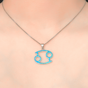 Opal Cancer Necklace displayed closely by being worn around a woman's neck.