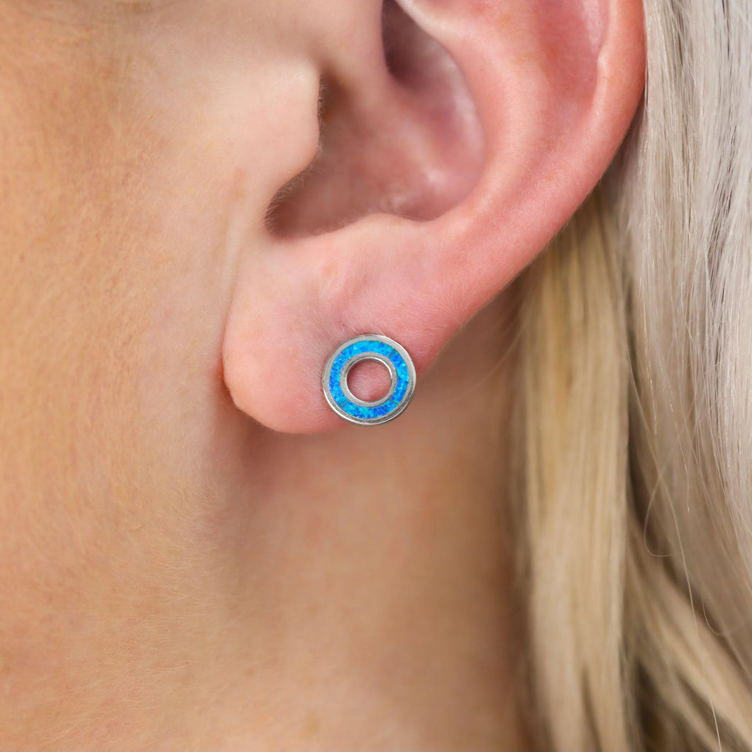 Opal Floatie Stud displayed closely by being worn on a woman's ear.