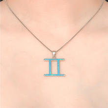 Load image into Gallery viewer, Opal Gemini Necklace displayed closely by being worn around a woman&#39;s neck.