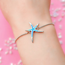 Load image into Gallery viewer, Opal Starfish Bracelet displayed closely by being worn around a woman&#39;s wrist.