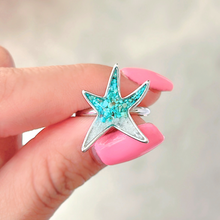 Load image into Gallery viewer, SSand Sea Star Ring elegantly showcased by a woman&#39;s hand.