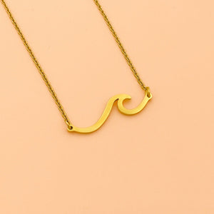 Wave Necklace displayed against a smooth peach background.