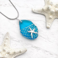 Load image into Gallery viewer, What a Catch Necklace in Ocean Blue displayed on a white wooden surface.