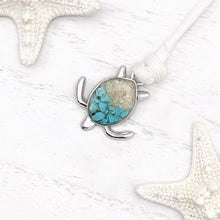 Load image into Gallery viewer, White Rope Sand Sea Turtle Bracelet in Teal Turquoise is displayed on a white wooden surface.