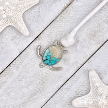 Load image into Gallery viewer, White Rope Sand Sea Turtle Bracelet in Teal Turquoise is displayed on a white wooden surface.