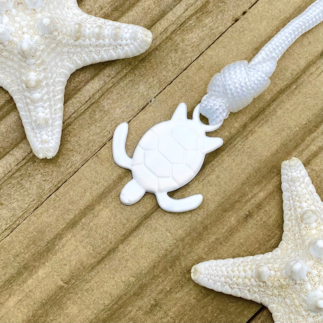 Whiteout Sea Turtle Bracelet displayed on a wooden surface.